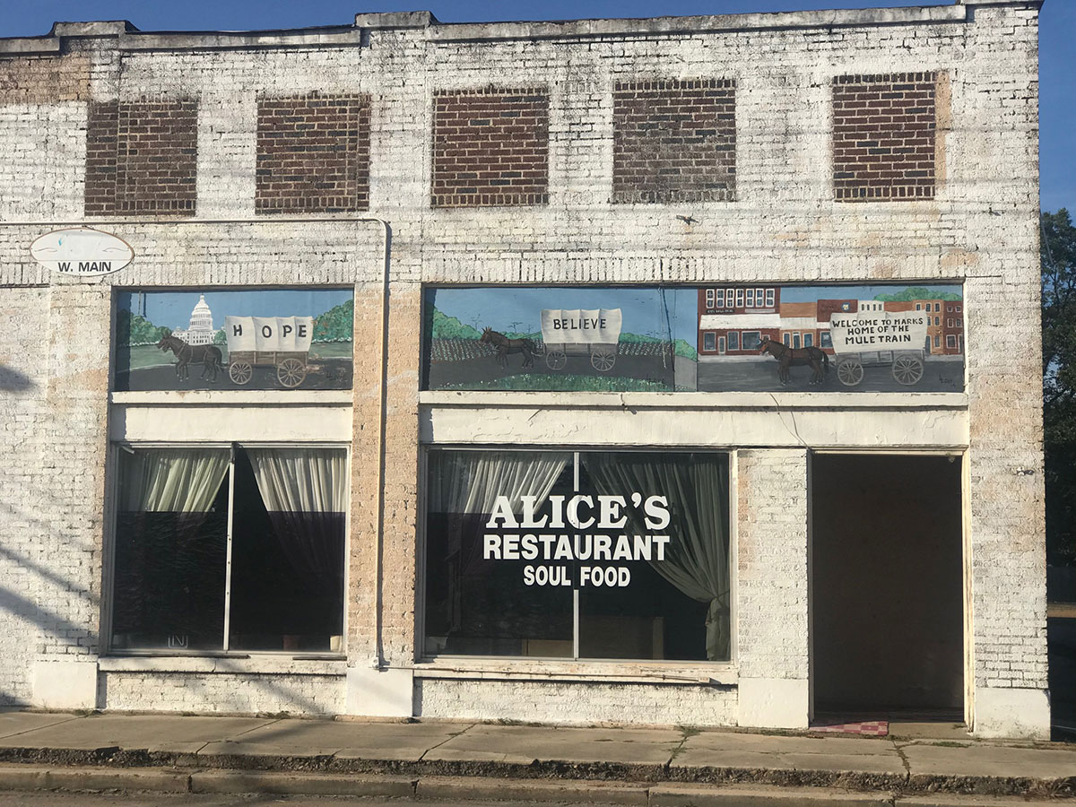 Exterior of Alice's Restaurant with Mule Train mural, Main Street, Marks, Mississippi.